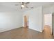 Bright bedroom with hardwood floors and ceiling fan at 213 Largo Dr, Poinciana, FL 34759