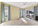 Bedroom with lake view and access to patio. Features carpet and ceiling fan at 256 New River Dr, Poinciana, FL 34759