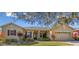 Beautiful one-story house with a two-car garage at 256 New River Dr, Poinciana, FL 34759