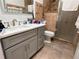 Bathroom with a double vanity, shower, and tiled floors at 2605 Coldstream Ct, Kissimmee, FL 34743