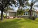 House exterior showcasing landscaping and a brick paved area at 2605 Coldstream Ct, Kissimmee, FL 34743