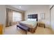 Spacious bedroom with a large bed and ensuite bathroom at 2627 Bugatti Ct, Kissimmee, FL 34746