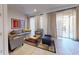 Relaxing living room with ample seating and access to patio at 2627 Bugatti Ct, Kissimmee, FL 34746