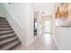 Bright and airy entryway with tile flooring and staircase at 2799 Bookmark Dr, Kissimmee, FL 34746