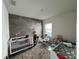 Bedroom with crib, changing table, and ample space at 2843 Turnstone Run, Harmony, FL 34773