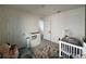 Second Bedroom with crib and additional storage at 2843 Turnstone Run, Harmony, FL 34773