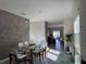 Bright dining area with glass table and modern chairs at 2843 Turnstone Run, Harmony, FL 34773