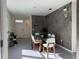 Dining room with glass table and access to entryway at 2843 Turnstone Run, Harmony, FL 34773