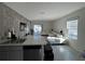 Open kitchen with stainless steel appliances and island at 2843 Turnstone Run, Harmony, FL 34773