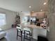 Open concept kitchen with island and breakfast bar at 2843 Turnstone Run, Harmony, FL 34773