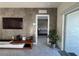 Open living room with a view of the bedroom and access to the outside at 2843 Turnstone Run, Harmony, FL 34773