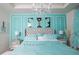 Elegant bedroom with Tiffany & Co. bedding and a crystal chandelier at 2937 Hooded Crane Cv, Harmony, FL 34773