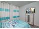 Bedroom with TV, dresser, and themed bedding at 2937 Hooded Crane Cv, Harmony, FL 34773