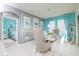 Bright dining room with seating for six and a view into the bedroom at 2937 Hooded Crane Cv, Harmony, FL 34773