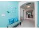 Bright entryway with decorative bench and view into the dining area at 2937 Hooded Crane Cv, Harmony, FL 34773