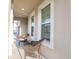 Relaxing front porch with wicker chairs and windows at 2937 Hooded Crane Cv, Harmony, FL 34773