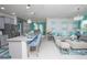 Open concept kitchen and living area with granite counters and stylish decor at 2937 Hooded Crane Cv, Harmony, FL 34773