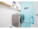 Convenient laundry room with washer, dryer, and cabinets at 2937 Hooded Crane Cv, Harmony, FL 34773