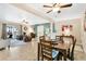 Open concept dining area with adjacent living room and kitchen at 310 Florida Ave, Saint Cloud, FL 34769