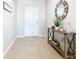 Bright entryway with tile flooring and console table at 321 Briarbrook Ln, Haines City, FL 33844