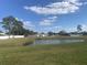 Backyard view with pond and neighborhood at 34 Pine Island Cir, Kissimmee, FL 34743
