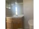 Bathroom with wood vanity, single sink, and toilet at 34 Pine Island Cir, Kissimmee, FL 34743