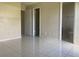 Bedroom with tile floors and access to bathroom at 34 Pine Island Cir, Kissimmee, FL 34743