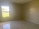 Bright bedroom with window, tile floors, and ample natural light at 34 Pine Island Cir, Kissimmee, FL 34743