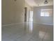 Spacious living room with light walls and tiled floors at 34 Pine Island Cir, Kissimmee, FL 34743