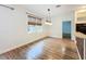 Dining area with hardwood floors, light walls, and a view to the kitchen at 3718 Winners Ct, Gotha, FL 34734