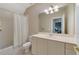 Clean bathroom with a shower/tub combo and vanity at 420 Arbor Cir, Celebration, FL 34747