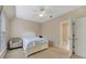 Bright bedroom with a white bed frame and access to a bathroom at 420 Arbor Cir, Celebration, FL 34747