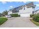 Two-car garage and a well-maintained front yard at 420 Arbor Cir, Celebration, FL 34747