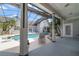 Covered patio with pool and spa views at 420 Arbor Cir, Celebration, FL 34747