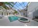 Inviting pool and spa with covered patio, perfect for relaxation at 420 Arbor Cir, Celebration, FL 34747