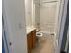 Clean bathroom with a shower/tub combo and wood vanity at 449 Heather Hill Blvd, Davenport, FL 33837