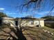 Back of house featuring solar panels and a sliding glass door at 449 Heather Hill Blvd, Davenport, FL 33837