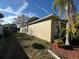 Side view of house with landscaping and a palm tree at 449 Heather Hill Blvd, Davenport, FL 33837