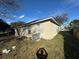 Back side of the house with AC unit and landscaping at 449 Heather Hill Blvd, Davenport, FL 33837