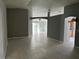 Open living room with tile floors and neutral walls at 449 Heather Hill Blvd, Davenport, FL 33837