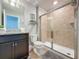 Bathroom with shower, toilet and granite countertop at 4626 Terrasonesta Dr, Davenport, FL 33837