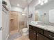 Bathroom with shower, toilet and granite vanity at 4626 Terrasonesta Dr, Davenport, FL 33837
