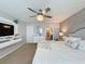 Main bedroom with king bed, TV, and ensuite bathroom at 4626 Terrasonesta Dr, Davenport, FL 33837