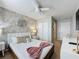Bright bedroom with a comfortable bed and stylish wall decor at 4626 Terrasonesta Dr, Davenport, FL 33837
