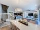 Bright dining room features a large table and chandelier, ideal for Gathering meals at 4626 Terrasonesta Dr, Davenport, FL 33837