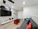 Fun-themed game room with Mickey Mouse decor and large TV, perfect for  at 4626 Terrasonesta Dr, Davenport, FL 33837