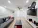 Fun-themed game room with Mickey Mouse decor and large TV, perfect for  at 4626 Terrasonesta Dr, Davenport, FL 33837