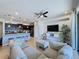 Open floor plan boasting a modern kitchen and spacious living area, perfect for entertaining at 4626 Terrasonesta Dr, Davenport, FL 33837