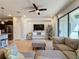 Bright living room with sectional sofa, large TV, and sliding glass doors to patio at 4626 Terrasonesta Dr, Davenport, FL 33837