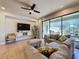 Comfortable living room featuring sectional sofa and sliding doors leading to backyard at 4626 Terrasonesta Dr, Davenport, FL 33837